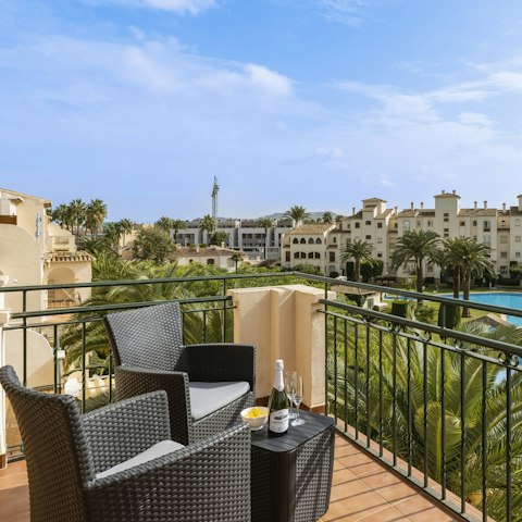 Share a glass of sparkling from your private balcony