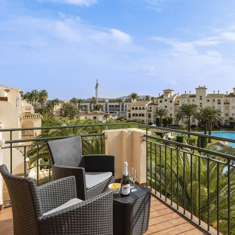 Share a glass of sparkling from your private balcony