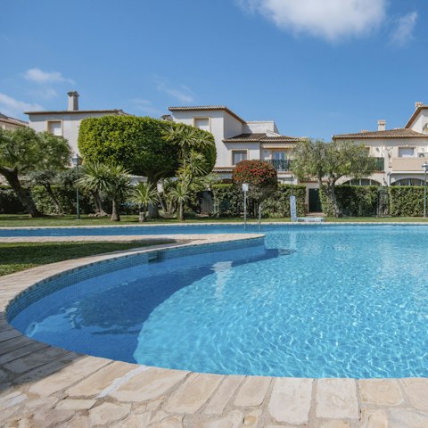 Take a cooling dip in the shared outdoor swimming pool