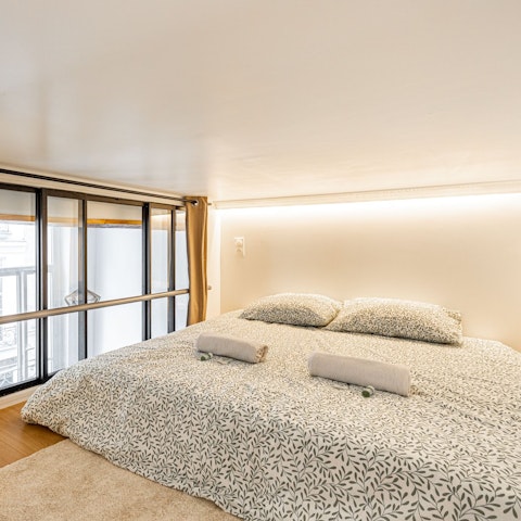 Enjoy loft-style living in the cosy mezzanine bedroom