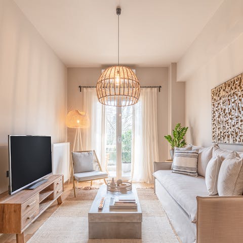 Relax and unwind in the bright living area, a glass of wine in hand