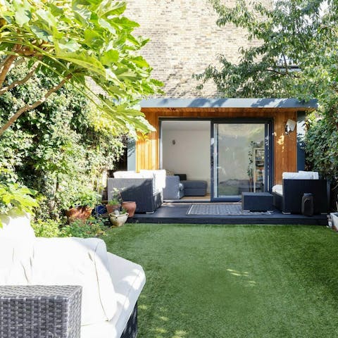 Curl up for a cosy movie night in the studio at the end of the garden