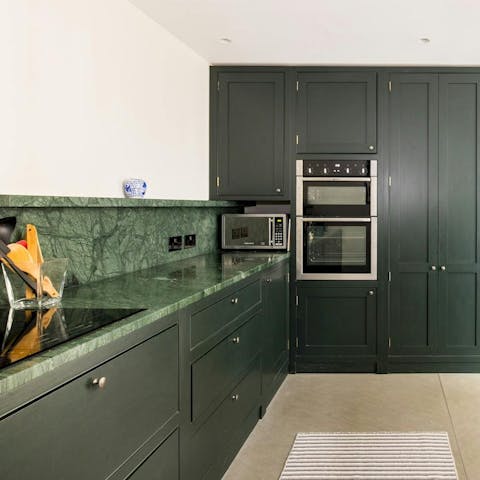 Make dinner in the kitchen using produce from the local market