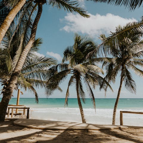 Spend long lazy days unwinding on the long stretch of sandy beach