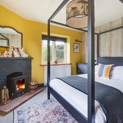 Enjoy cosy evenings in your four-poster bed with a good book and the crackling fire