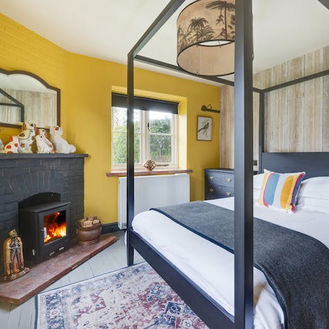 Enjoy cosy evenings in your four-poster bed with a good book and the crackling fire