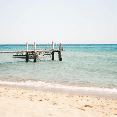 Stay just a few steps away from sandy Karvouno Beach