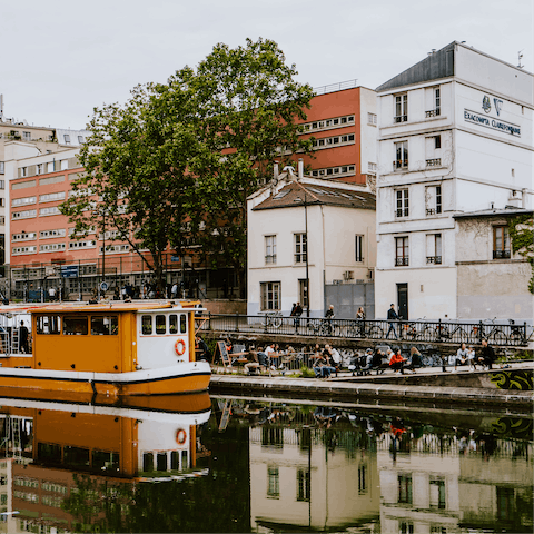 Wander along to Canal Saint-Martin, less than ten minutes away