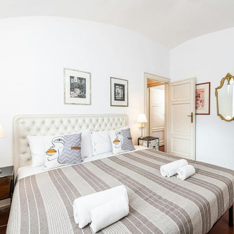 Sink into the sumptuous bed after a day of sightseeing in Rome