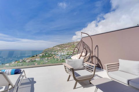 Nestle down in the hanging egg chair with your holiday read, swaying gently in the sea breeze