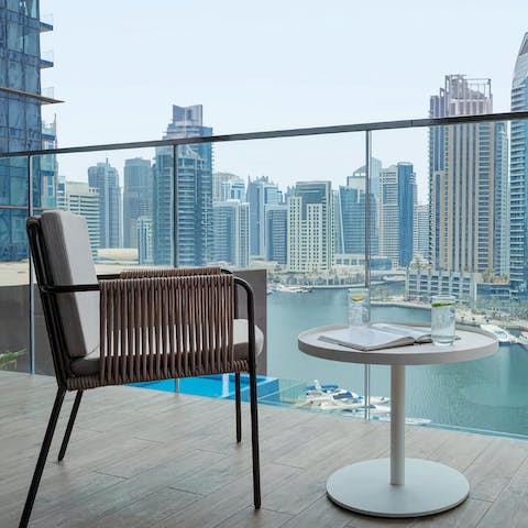 Enjoy your morning coffee on your balcony, overlooking the iconic marina