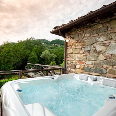Catch the sunset from the comfort of the home's hot tub on the terrace