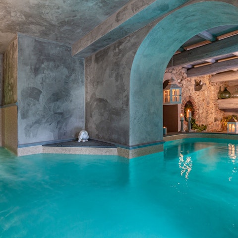 Float elegantly through the heated waters of the atmospheric indoor swimming pool