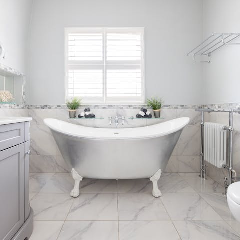Have a long soak in the silver freestanding bath after a busy day in London