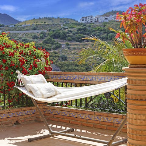 Have a siesta in the hammock overlooking the countryside