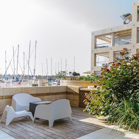 Enjoy views of the boats at the marina from the peaceful patio area