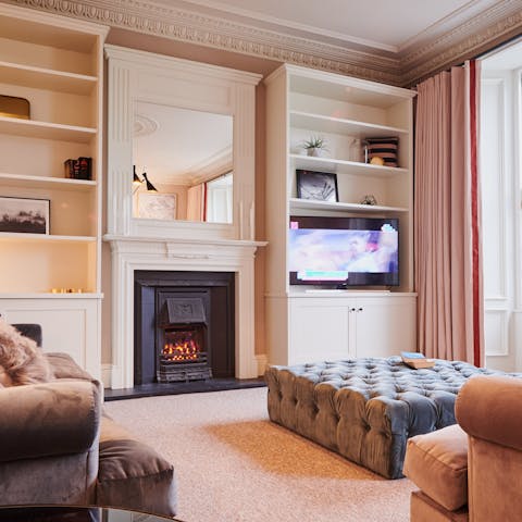 Get the electric fireplace glowing in the living room