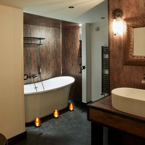 Soak you troubles away in the striking master bathtub