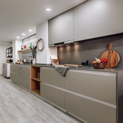 Rustle up a delicious dinner in the sleek kitchen