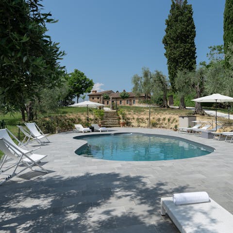 Spend carefree days stretched out by the pool