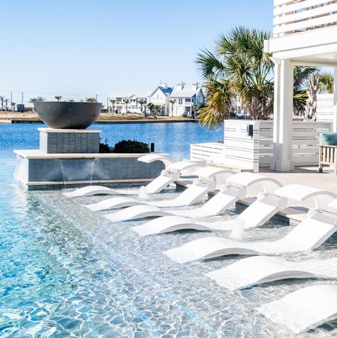 Head down to the communal pool and relax on a lounger