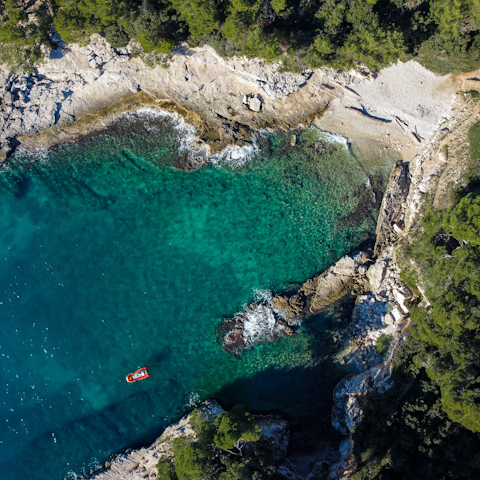 Discover Pula's turquoise waters, a short drive away