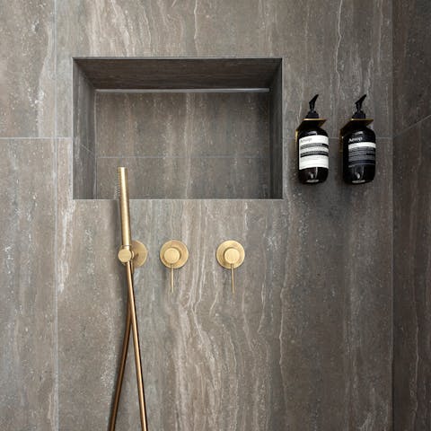 Begin your mornings under rainfall showers in the marble en-suite bathrooms