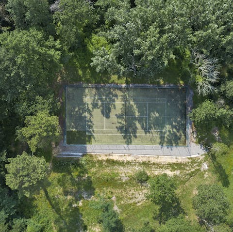 Discover your competitve side at the private tennis court