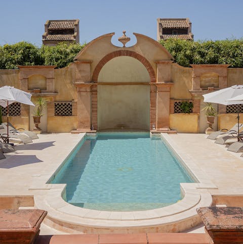 Lounge with the family by the Art Nouveau style pool
