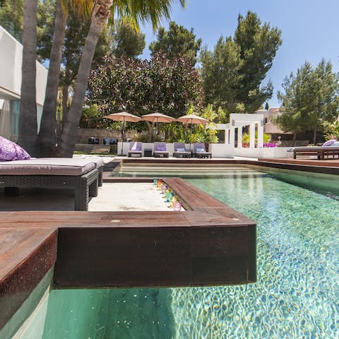 Lounge by the pool on one of sun loungers before going for a cooling lap
