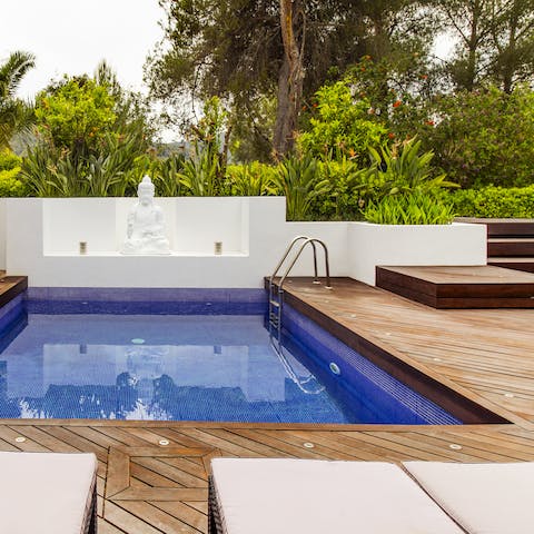Book a yoga session on the vinyasa platform by the Buddha pool