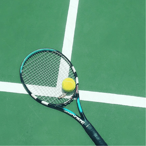 Challenge your group to a round of tennis, located on the lakeside development where you'll be staying