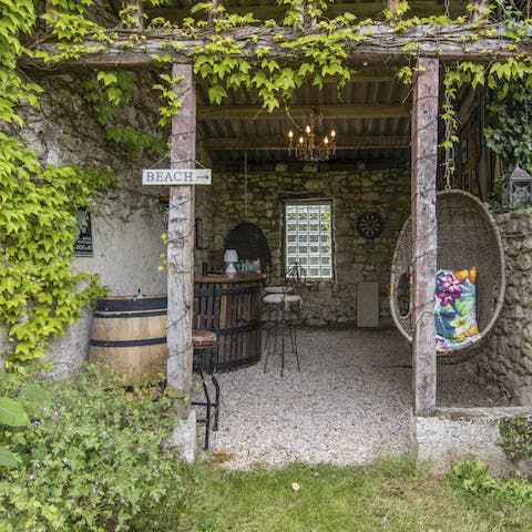 Pour yourself a drink at the bar