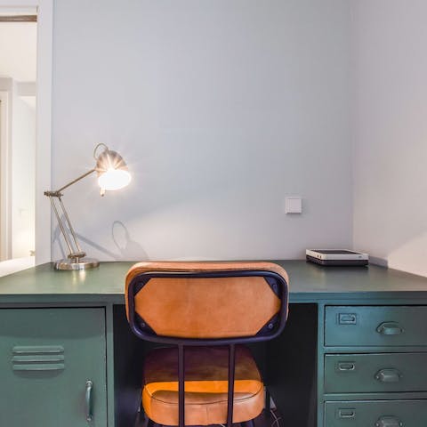 Catch up on work or research Madrid at the desk in the bedroom