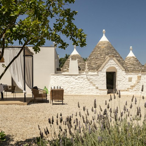 Admire the traditional Trulli cones from the shade of the terrace