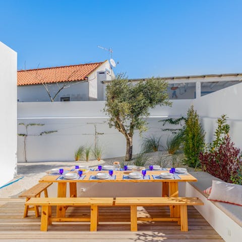 Hire a chef to cook a seafood dinner for your family and dine alfresco at sunset
