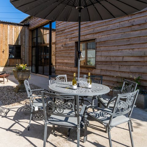 Relax in the courtyard garden with a glass of English fizz