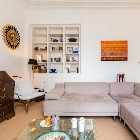 Relax in the living room with a cup of Earl Grey and one of the books on the shelves