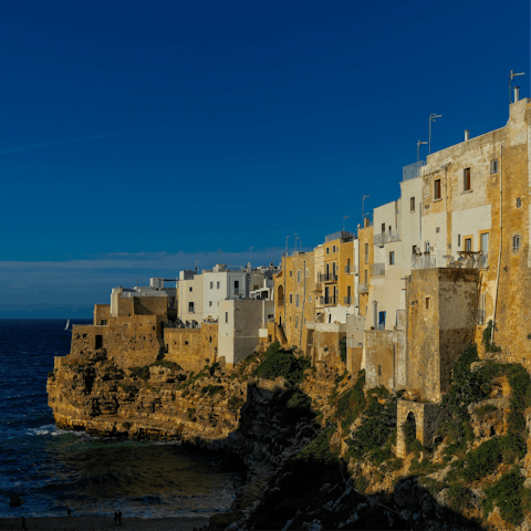 Take a thirty five minute drive down the coast to the stunning Polignano a Mare