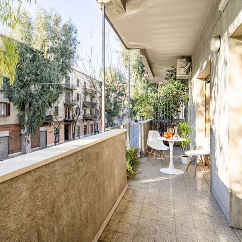 Enjoy a drink and a moment of the calm on the balcony