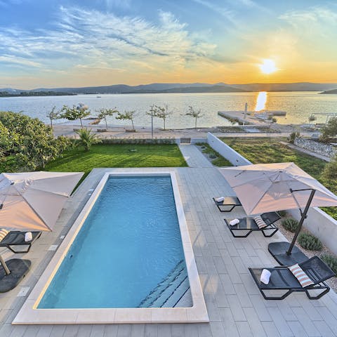 Step from your swimming pool straight onto the beach