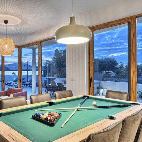 Convert the dining table into a pool table and get competitive
