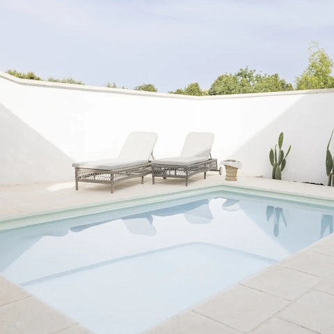 Spend a day horizontal, lounging by the private pool