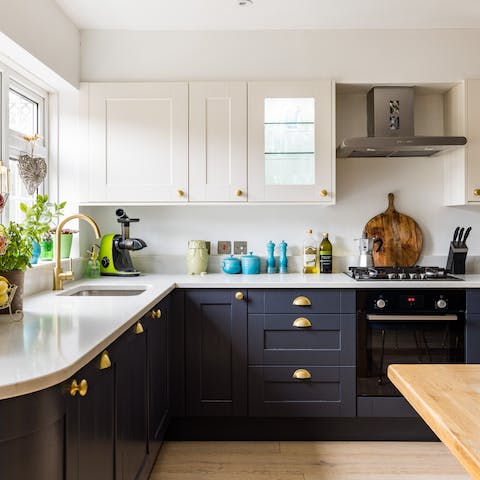 Make some fresh orange juice in the stylish kitchen