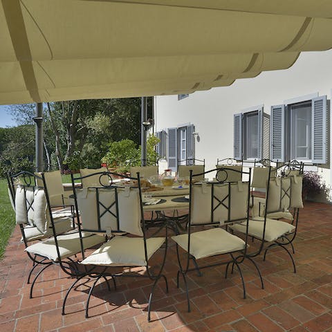 Gather around the large, sociable outdoor table for