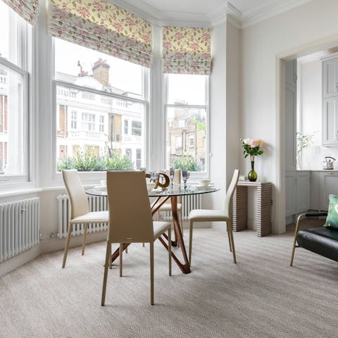 Unwind in the light-filled living room with bay window views