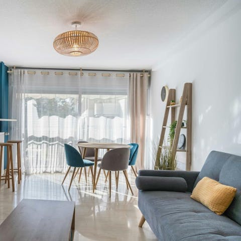 Relax in the living room with a glass of chilled French wine