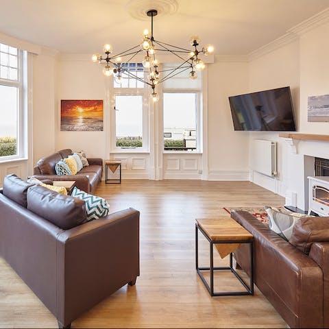 Gaze out of the binoculars at the sea view while the fireplace keeps you toasty