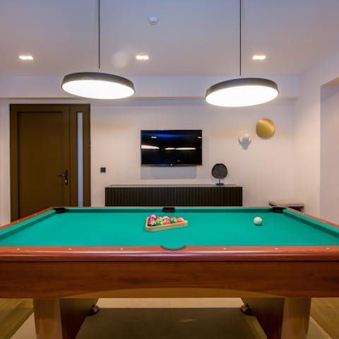 Play a few rounds of pool in the games room