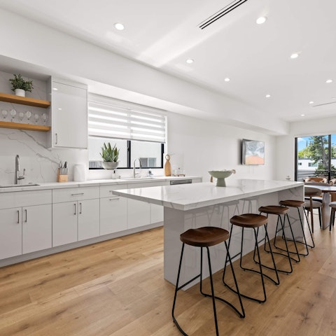 Whip up delicious meals in the sleek, open-plan kitchen